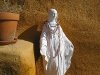 Mary blesses the courtyard at Riverbend daily.