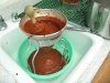 Strained red chili sauce for homemade red meat tamales
