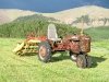 Antique Farmall Tractor with Rake in Vickers Ranch Hayfield