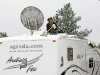 Rene cleans snow off Arctic Fox roof