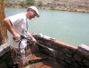 Jim power-washes hot mineral bath tubs at Riverbend Hot Springs