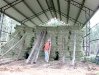 Jim stacks hay bales in the vickers hay Barn