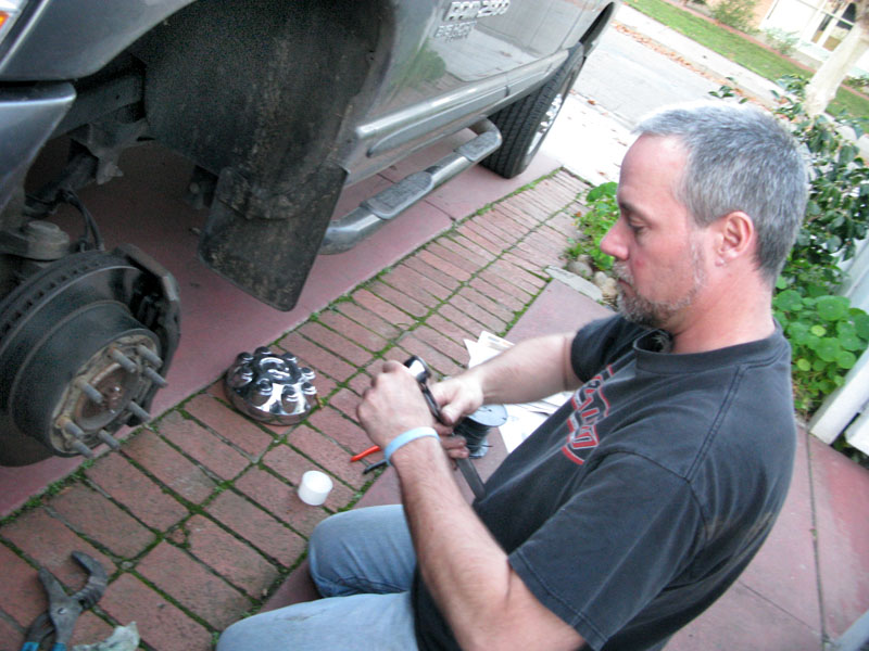 Jim applies brake noise spray to Dodge Ram 2500 squeaky brakes