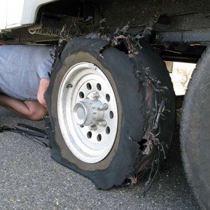 Flat Tire Protection Provides Peace of Mind Changing-Fifth-Wheel-Trailer-Tire-Blowout
